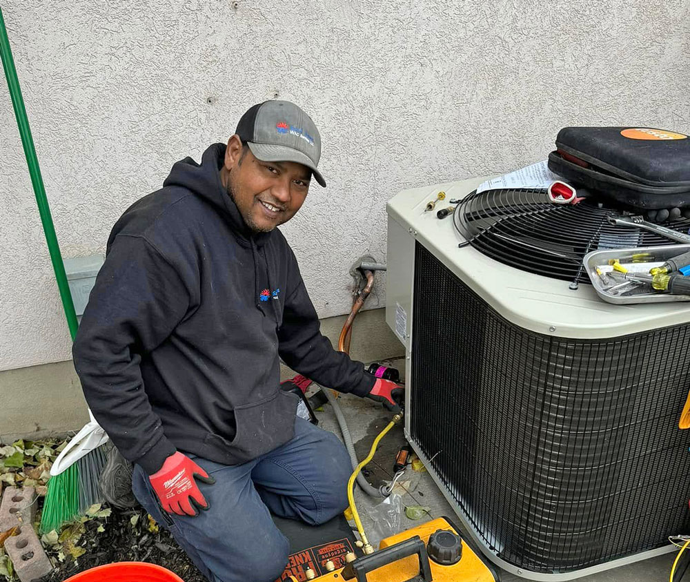 Sami James HVAC Technician Samuel working on a AC Unit