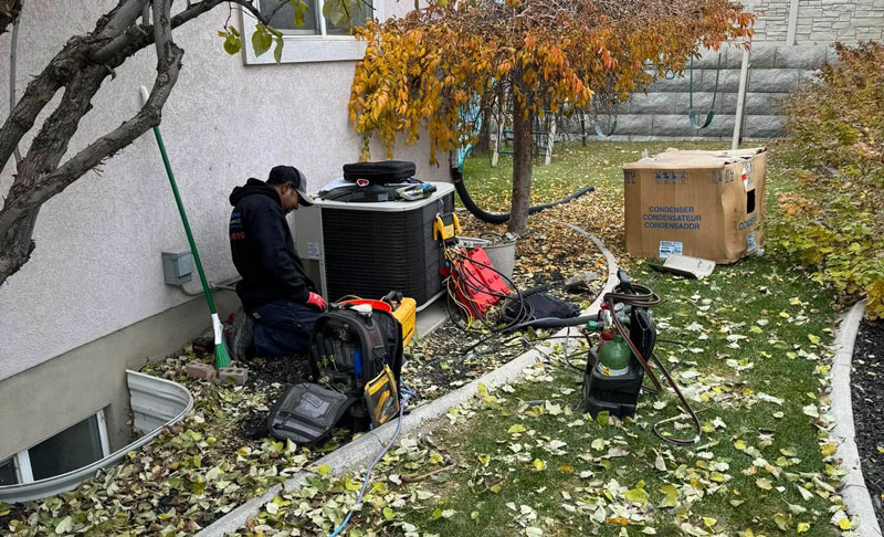 Sami James HVAC installing a new Air Conditioner outside a home